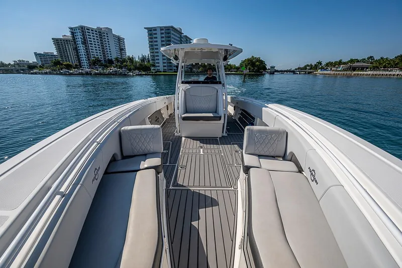 Slide: The Image of 2020 Fountain 38 Center Console boat on water with cityscape background. - 17