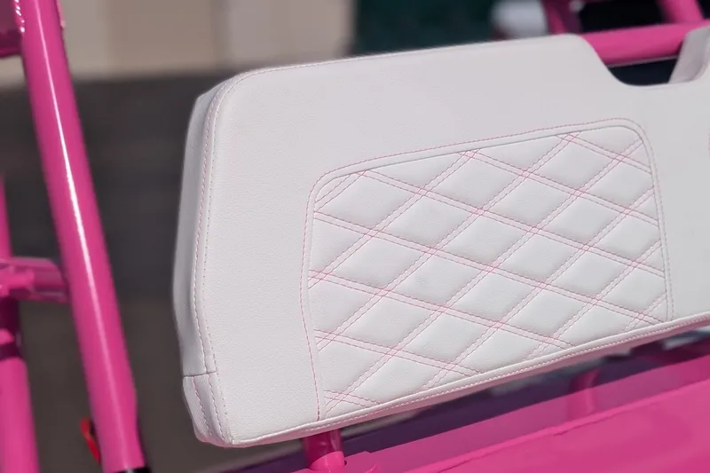 Slide: The Image of Custom pink and white seat detail on 2026 Tide Craft Catalina 13 boat. - 4