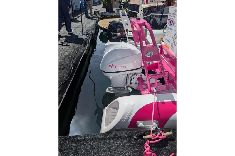 Slide: The Image of 2026 Tide Craft Custom Pink & White Catalina 13 boat with Tohatsu engine at dock. - 10