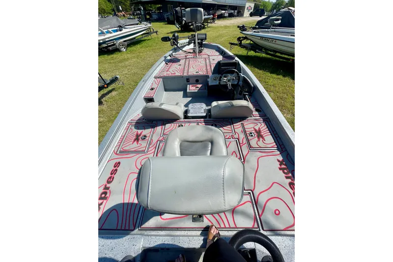 Slide: The Image of 2020 Xpress X21 Pro boat interior with patterned flooring and seating. - 4