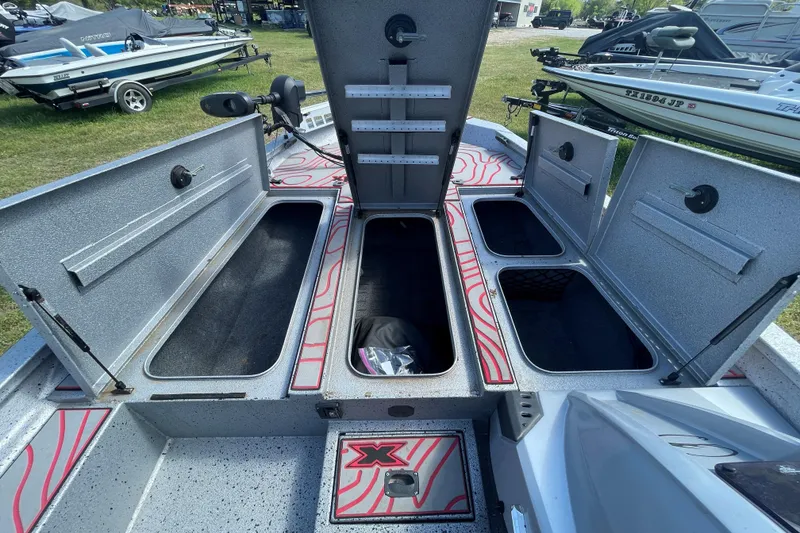 Slide: The Image of Open storage compartments on a 2020 Xpress X21 Pro boat, showcasing ample space and design. - 5