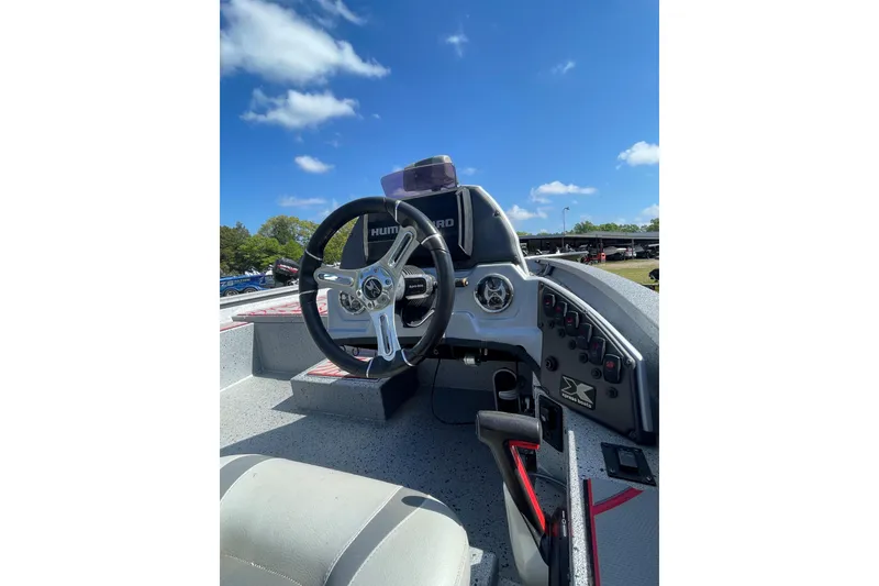 Slide: The Image of Cockpit of 2020 Xpress X21 Pro boat with steering wheel and control panel. - 6