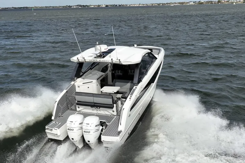 The Image of 2023 Galeon 325 GTO yacht cruising on open water, rear view. - 0