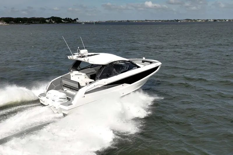 Slide: The Image of 2023 Galeon 325 GTO cruising on open water, showcasing sleek design and powerful engines. - 1