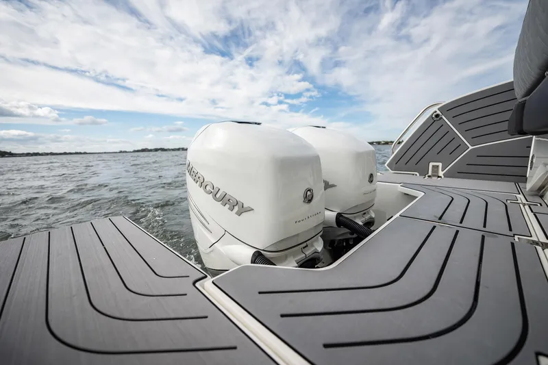 Slide: The Image of 2023 Galeon 325 GTO boat with twin Mercury outboard engines on a calm sea. - 12