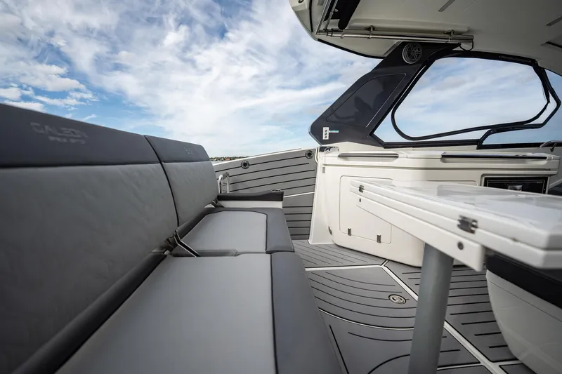 Slide: The Image of 2023 Galeon 325 GTO yacht interior with sleek seating and modern design. - 14