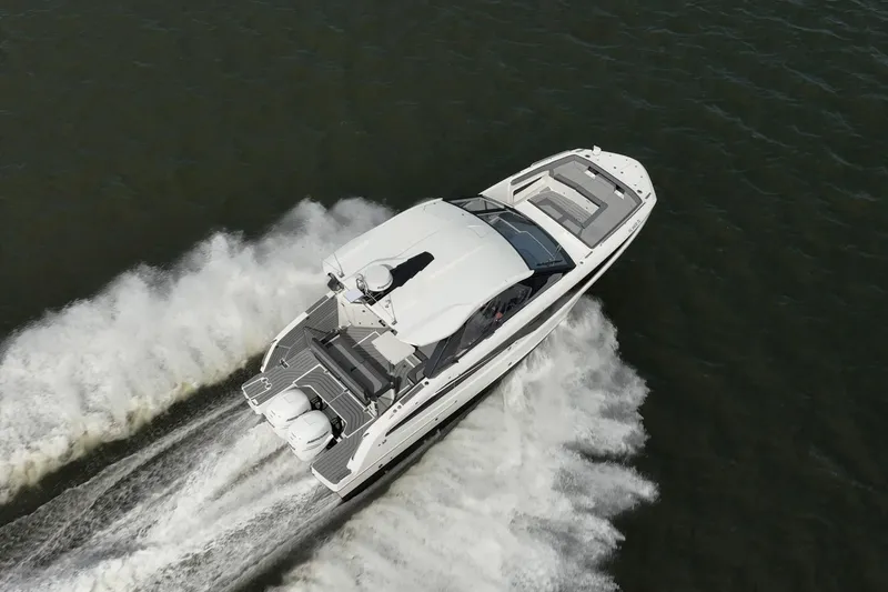 Slide: The Image of Aerial view of 2023 Galeon 325 GTO yacht cruising on open water. - 2