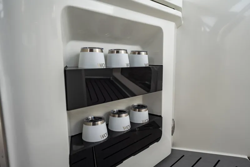Slide: The Image of Cup holders inside 2023 Galeon 325 GTO boat, showcasing sleek interior design. - 25
