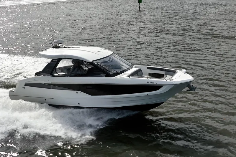 Slide: The Image of 2023 Galeon 325 GTO cruising on open water, showcasing sleek design and performance. - 3