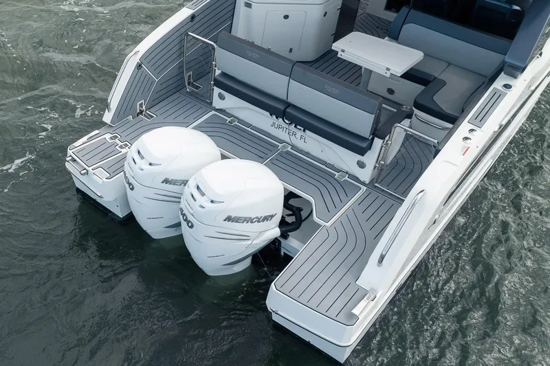 Slide: The Image of 2023 Galeon 325 GTO boat with dual Mercury outboard engines on water. - 31