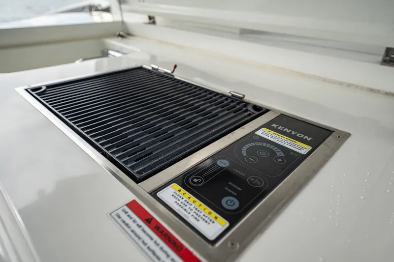 Slide: The Image of Built-in Kenyon grill on 2023 Galeon 325 GTO yacht, featuring sleek control panel. - 35