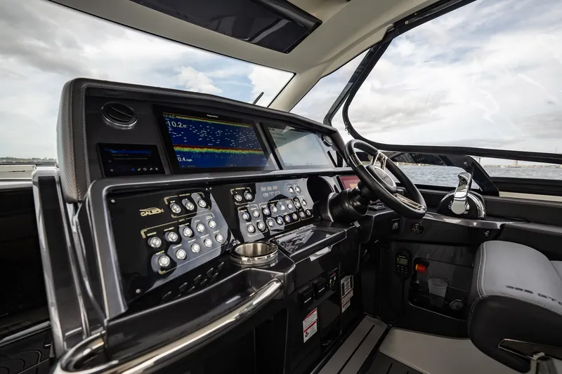 Slide: The Image of 2023 Galeon 325 GTO helm with advanced navigation controls and sleek design. - 38