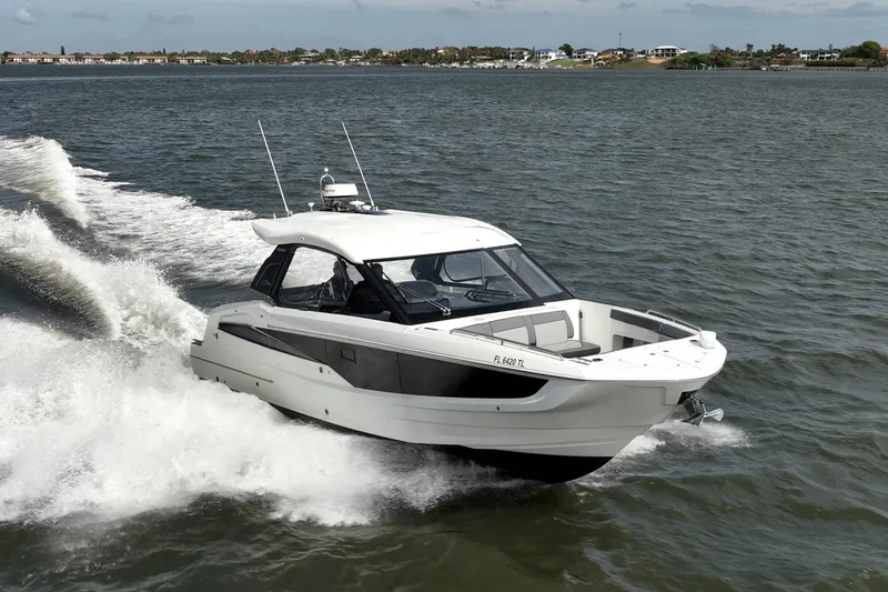 Slide: The Image of 2023 Galeon 325 GTO cruising on open water, showcasing sleek design and performance. - 5