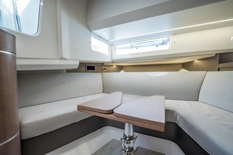 Slide: The Image of Interior of 2023 Galeon 325 GTO yacht with modern seating and table. - 51