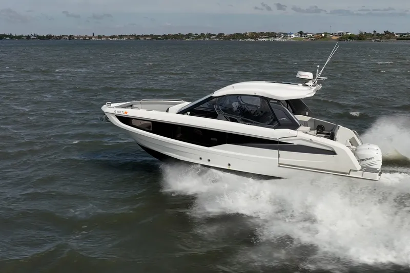 Slide: The Image of 2023 Galeon 325 GTO cruising on open water, showcasing sleek design and performance. - 7