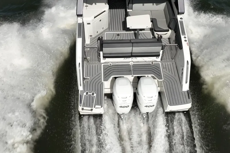 Slide: The Image of 2023 Galeon 325 GTO boat cruising with dual engines, rear view. - 8