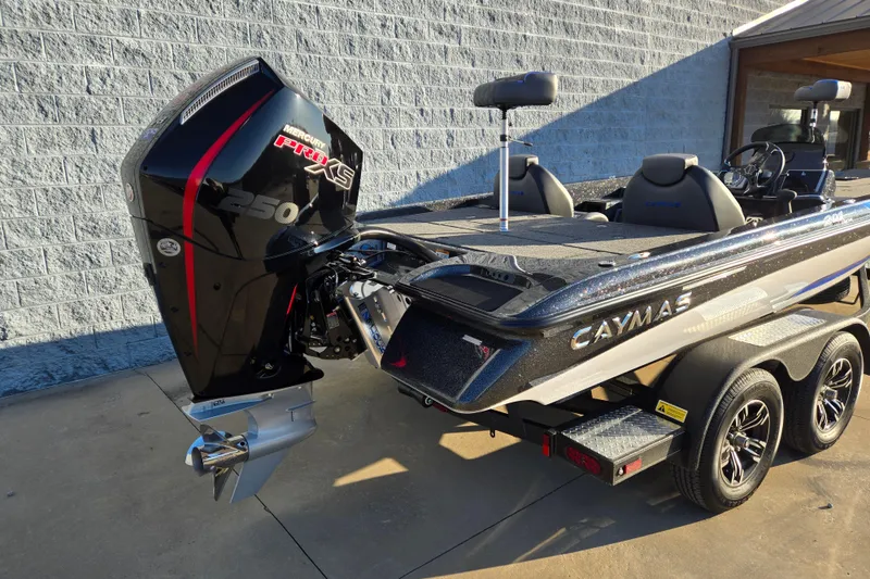 Slide: The Image of 2027 Caymas 201 Pro boat with Mercury 250 Pro XS engine, parked on a trailer. - 3