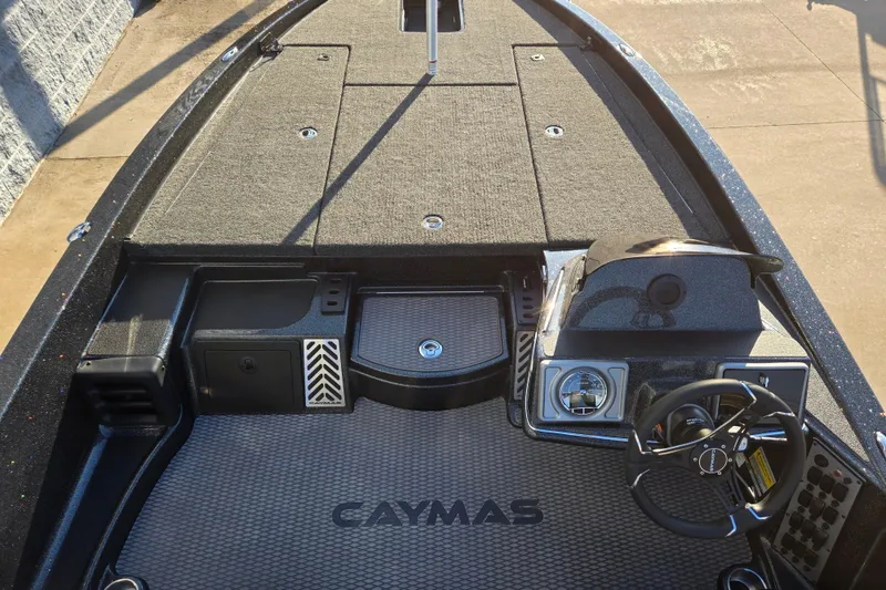 Slide: The Image of 2027 Caymas 201 Pro boat interior with steering wheel and deck layout. - 7