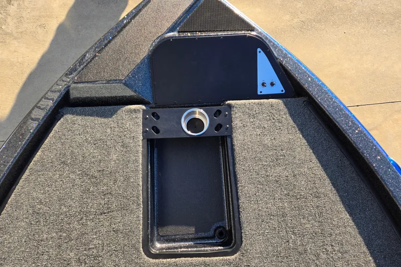 Slide: The Image of Bow deck of 2027 Caymas 201 Pro boat with carpeted surface and cup holder. - 8