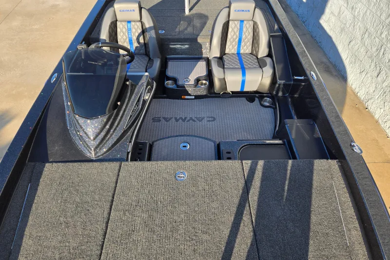Slide: The Image of 2027 Caymas 201 Pro boat interior with dual seats and steering console. - 9