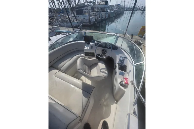 Slide: The Image of 1999 Bayliner 2858 Ciera Command Bridge helm with marina view. - 19