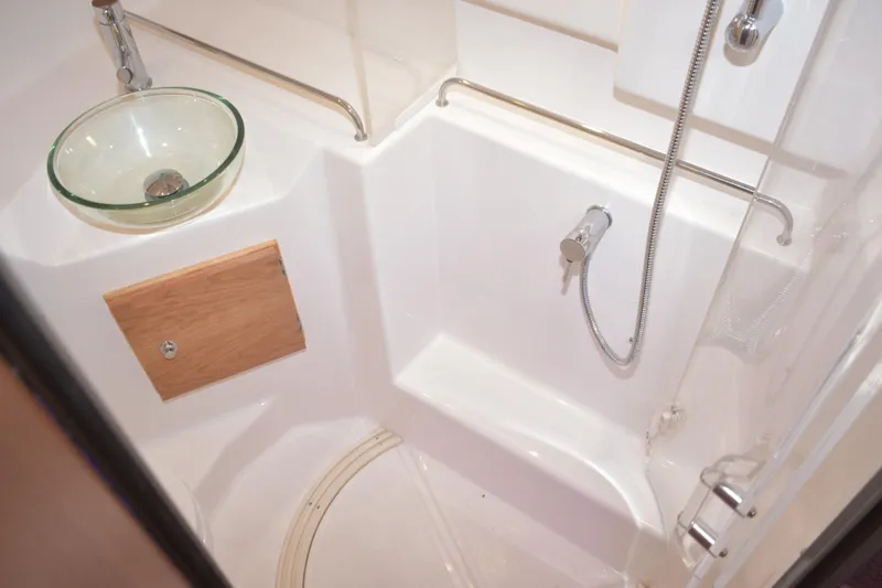 Slide: The Image of 2026 Cutwater C-32 CB yacht bathroom with glass sink and shower. - 27