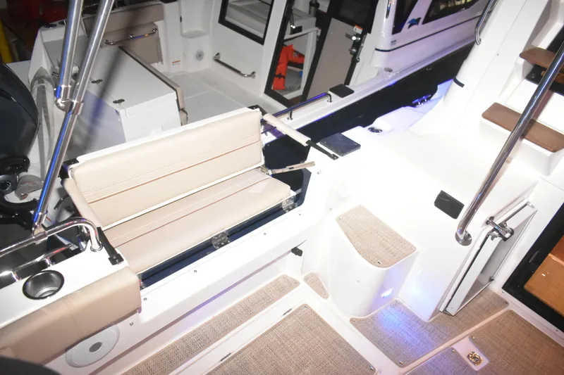 Slide: The Image of Interior view of 2026 Cutwater C-32 CB boat, featuring seating and modern design elements. - 39