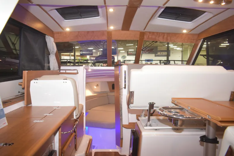 Slide: The Image of Interior of 2026 Cutwater C-32 CB boat with modern seating and lighting. - 4