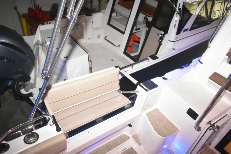 Slide: The Image of 2026 Cutwater C-32 CB boat interior with seating and Yamaha engine. - 40