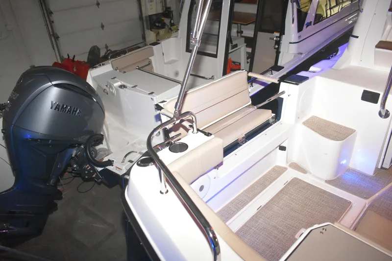 Slide: The Image of 2026 Cutwater C-32 CB boat interior with Yamaha engine, featuring seating and modern design. - 41