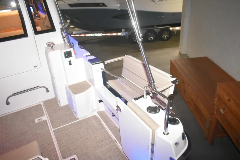 Slide: The Image of 2026 Cutwater C-32 CB boat interior with seating and cup holders. - 42