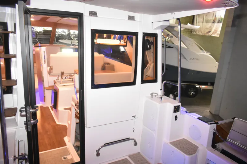 Slide: The Image of Interior view of 2026 Cutwater C-32 CB boat, showcasing modern design and amenities. - 47