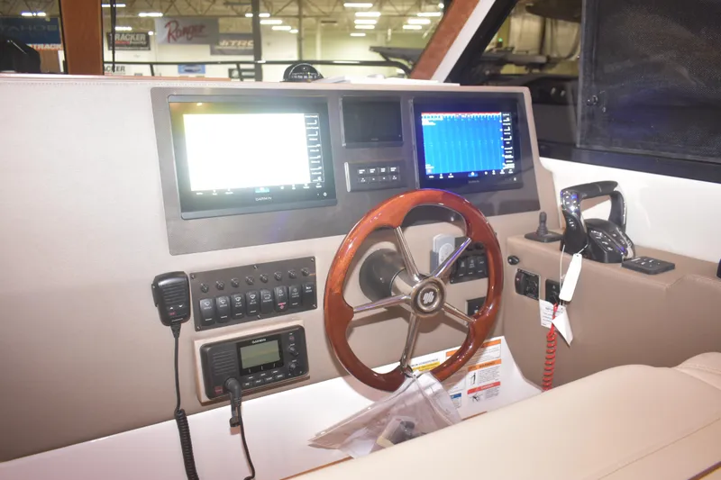 Slide: The Image of Helm of 2026 Cutwater C-32 CB with advanced navigation displays and controls. - 7