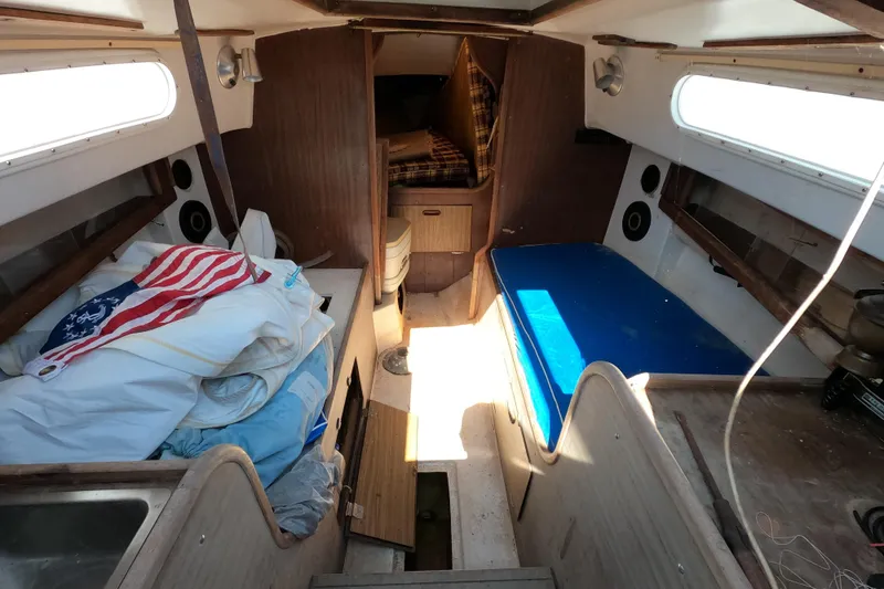 Slide: The Image of Interior of a 1976 Cape Dory 25 sailboat with seating and storage. - 4