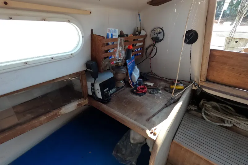 Slide: The Image of Interior of a 1976 Cape Dory 25 sailboat with navigation equipment and tools. - 9