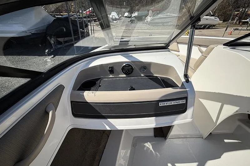 Slide: The Image of 2016 Bayliner 185 Bowrider dashboard with steering wheel and instrument panel. - 11