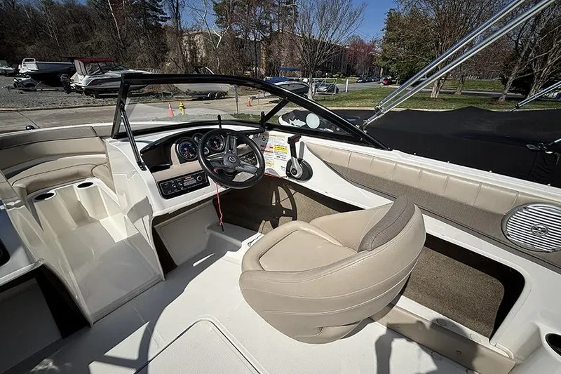 Slide: The Image of 2016 Bayliner 185 Bowrider interior with steering wheel and seating. - 13