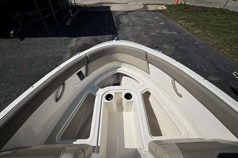 Slide: The Image of 2016 Bayliner 185 Bowrider boat interior with seating and cup holders. - 17