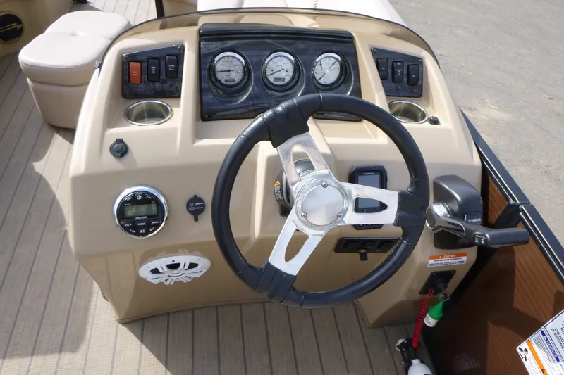 Slide: The Image of Steering console of a 2018 Bennington 24 SSRX pontoon boat with gauges and controls. - 12