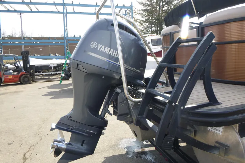 Slide: The Image of 2018 Bennington 24 SSRX with Yamaha outboard motor and boarding ladder. - 15