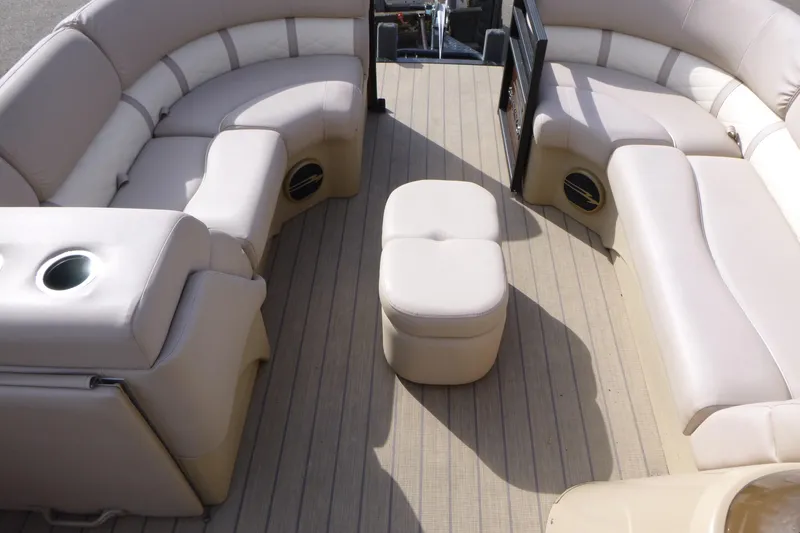 Slide: The Image of 2018 Bennington 24 SSRX pontoon boat interior with beige seating and flooring. - 8