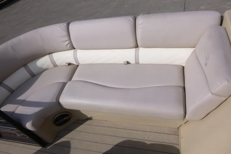 Slide: The Image of 2018 Bennington 24 SSRX boat interior seating with beige upholstery. - 9