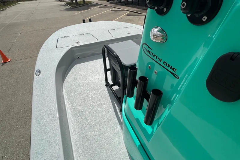 Slide: The Image of 2026 Gulf Coast Saber Cat boat deck with rod holders and sleek design. - 14