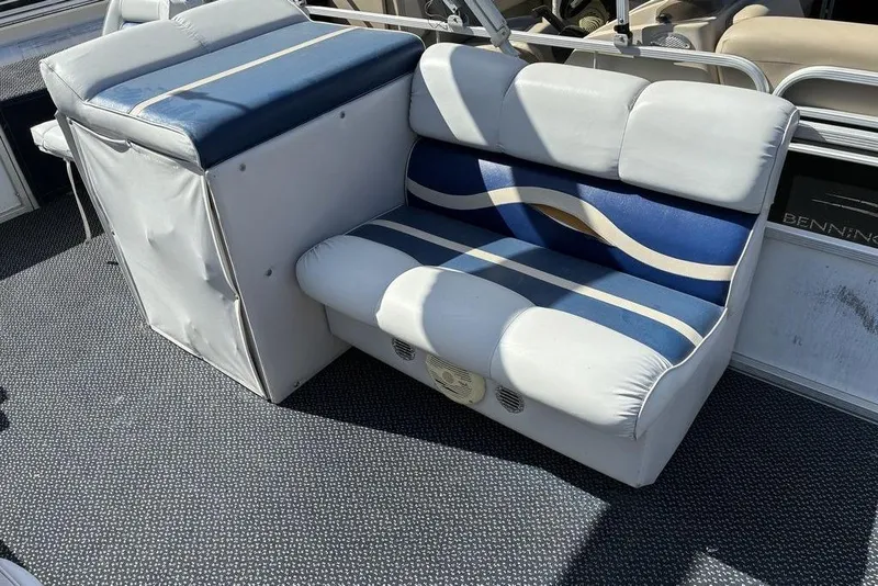Slide: The Image of 2001 Leisure Kraft 20 Fish and Cruise boat seating with blue and white upholstery. - 3