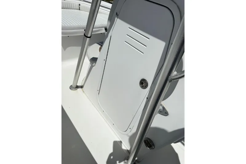 Slide: The Image of 2008 Sea Fox 216 Center Console boat interior with storage compartment and railing. - 10