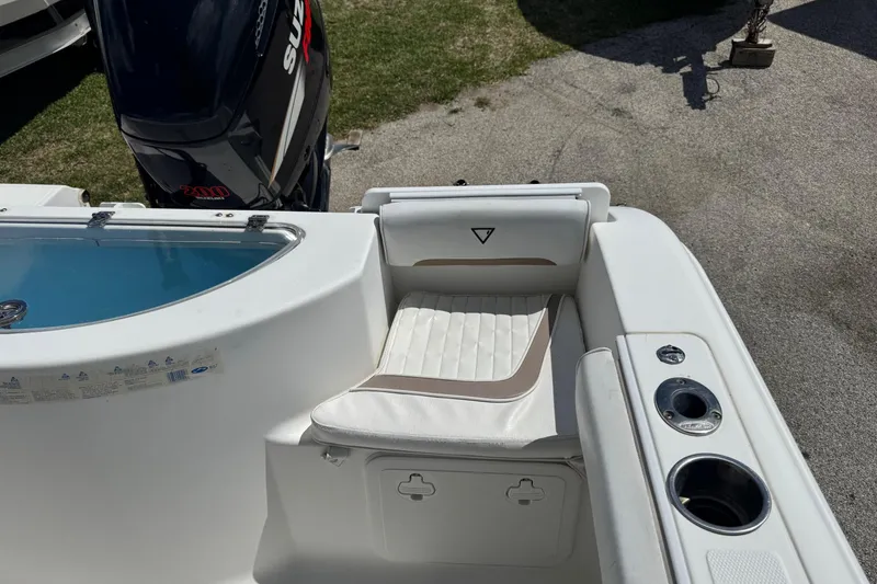 Slide: The Image of 2008 Sea Fox 216 Center Console boat interior with seating and Suzuki outboard motor. - 17