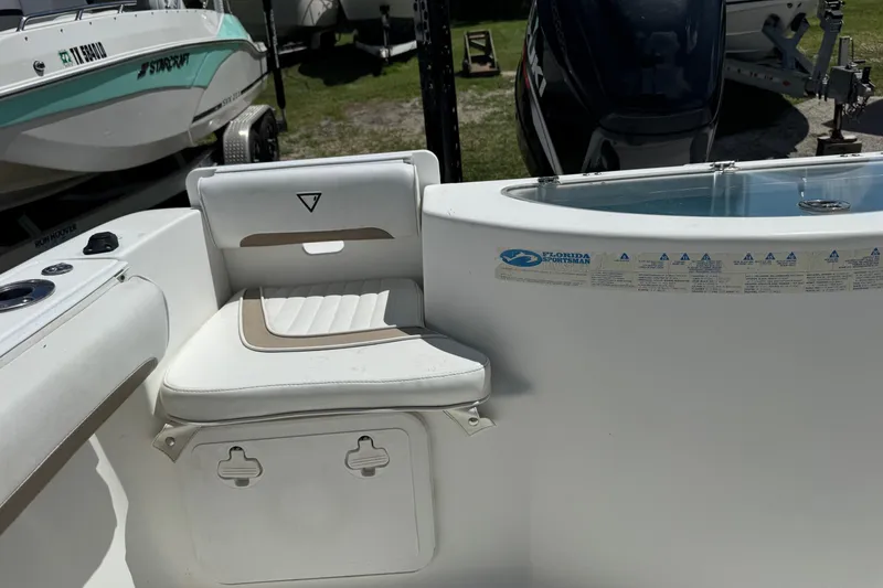 Slide: The Image of 2008 Sea Fox 216 Center Console boat interior with seating and storage. - 19