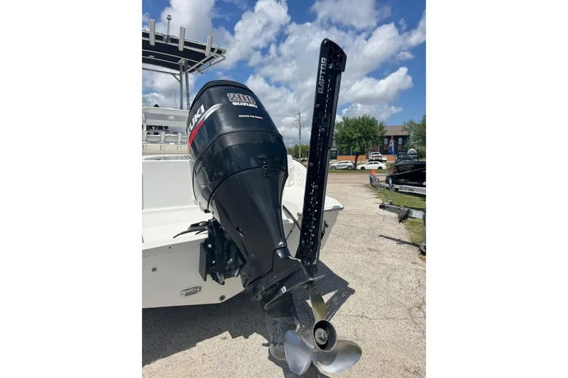 Slide: The Image of 2008 Sea Fox 216 Center Console with Suzuki 200 outboard motor, parked outdoors. - 3
