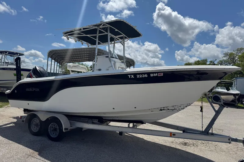 Slide: The Image of 2008 Sea Fox 216 Center Console boat on trailer under blue sky. - 4