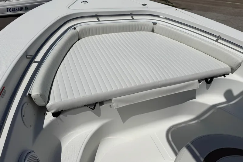 Slide: The Image of 2008 Sea Fox 216 Center Console boat with white cushioned seating area. - 6
